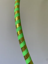 Load image into Gallery viewer, Hula hoop for beginners with gold and green striped pattern on a plain background